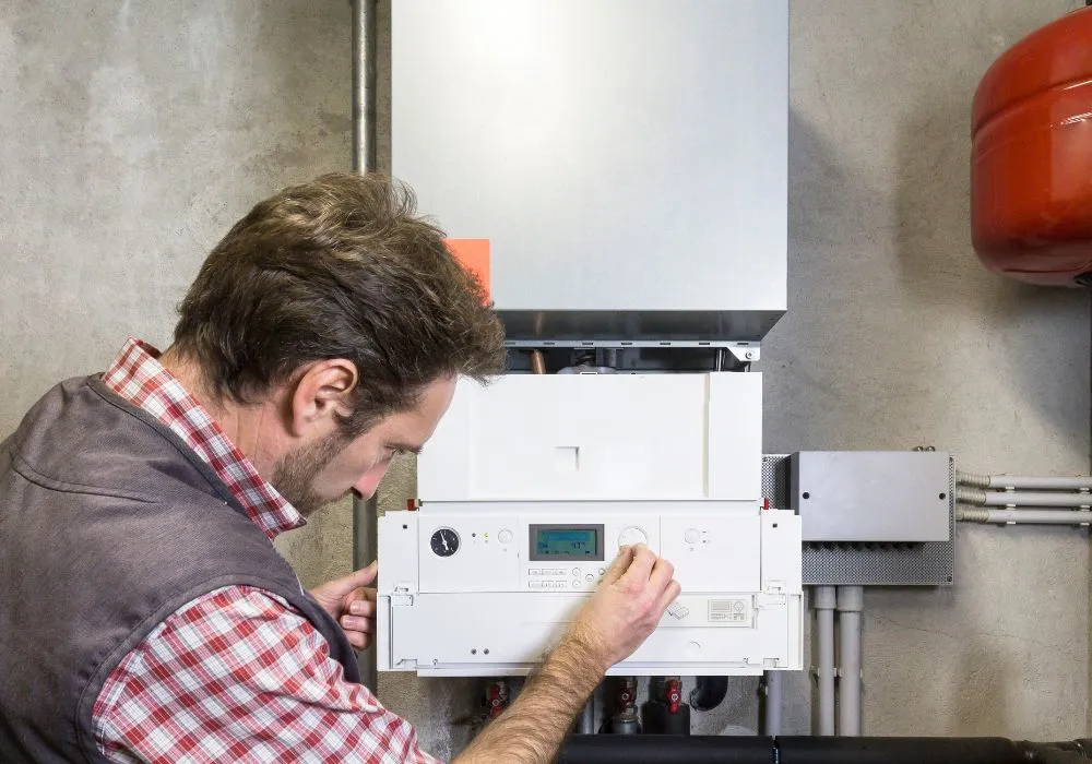 Accolade Heating technician performing furnace maintenance in Fleetwood your home