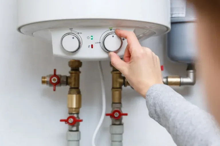 HVAC technician reviewing townhome mechanical room for heat pump installation